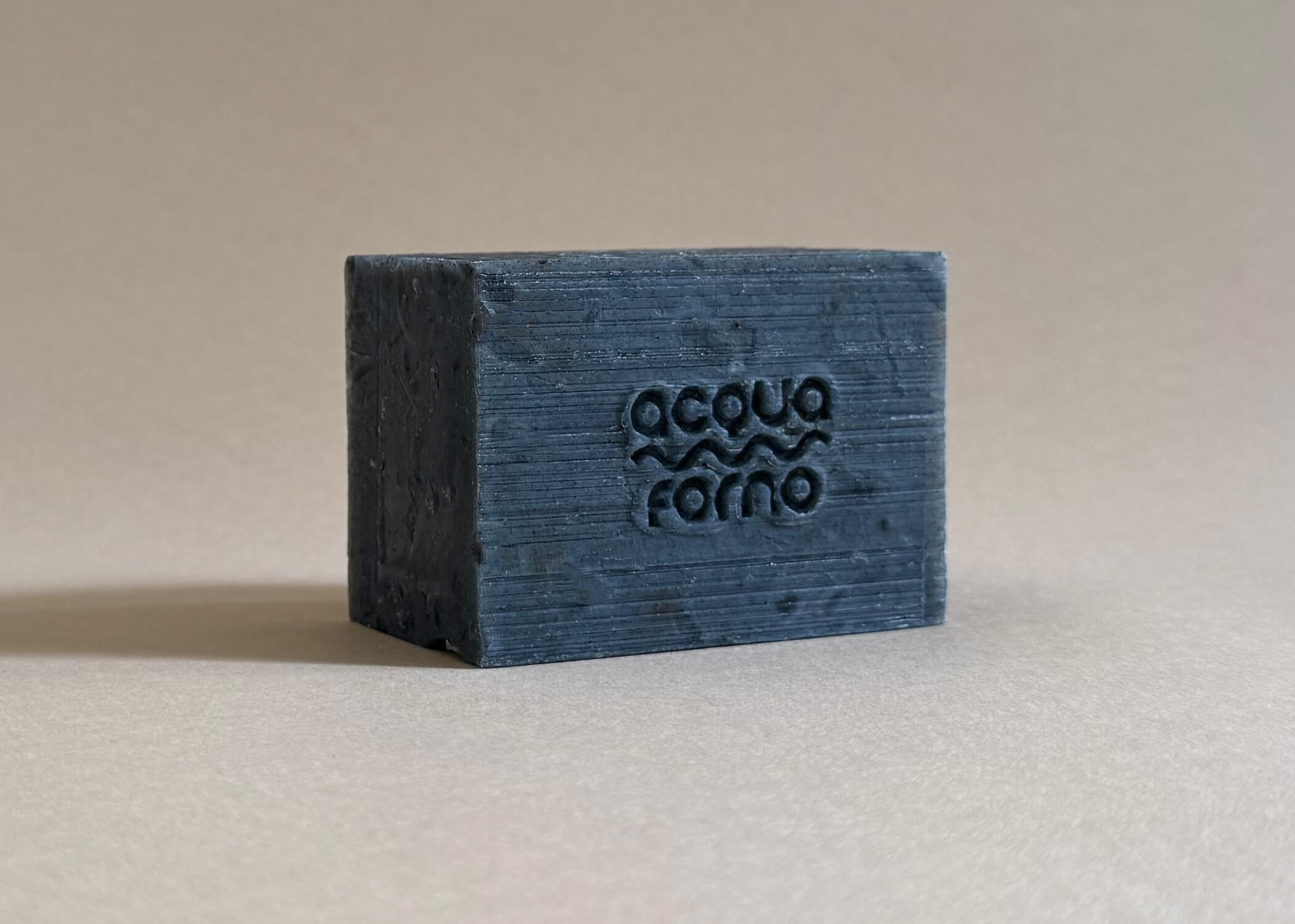 Textured cold process soap in black, made with activated charcoal and licorice root for natural skin detox