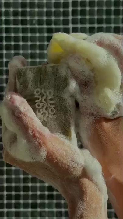 Model using Acqua Forno body soap with olive oil and aloe – gentle, moisturizing shower bar