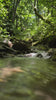 Serene river flowing through rocky terrain in Il Forno, Tuscany, capturing the essence of nature's tranquility